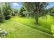 Sprawling backyard with mature trees, and a gently flowing stream at 13020 Lombard Ct, Fishers, IN 46038