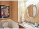 Cozy powder room features wainscotting, granite countertop, decorative mirror, and stylish fixtures at 13020 Lombard Ct, Fishers, IN 46038