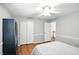Bright bedroom featuring bed with wood flooring, large closet, ceiling fan and natural light at 13020 Lombard Ct, Fishers, IN 46038