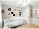 Bright bedroom featuring a stylish bed with decorative pillows, artwork and a closet at 13020 Lombard Ct, Fishers, IN 46038