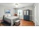Bright bedroom featuring bed with wood flooring, large closet, ceiling fan and natural light at 13020 Lombard Ct, Fishers, IN 46038