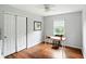 Bright bedroom featuring wood flooring, large closet and a work space with natural light at 13020 Lombard Ct, Fishers, IN 46038