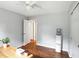 A bright bedroom features hardwood floors, gray walls, white trim, and an updated ceiling fan at 13020 Lombard Ct, Fishers, IN 46038