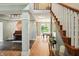 Spacious foyer with hardwood floors and staircase, creating an inviting entrance to the home at 13020 Lombard Ct, Fishers, IN 46038