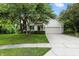 Charming two-story home with landscaped front yard and attached two-car garage on a sunny day at 13020 Lombard Ct, Fishers, IN 46038