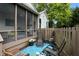 Serene patio area with lounge chairs, outdoor decor, and a view of the yard at 13020 Lombard Ct, Fishers, IN 46038