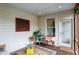 Charming covered porch with vintage Coca-Cola cooler and casual seating at 13020 Lombard Ct, Fishers, IN 46038