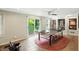 Spacious recreation room with ping pong table, sliding doors and built-in shelving at 13020 Lombard Ct, Fishers, IN 46038