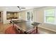 Bright recreation room with ping pong table and access to the outside at 13020 Lombard Ct, Fishers, IN 46038