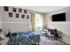 Comfortable bedroom with a large TV and natural light, perfect for a or teen at 1305 Gumwood Dr, Indianapolis, IN 46234