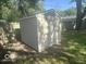 Backyard with a storage shed, perfect for housing tools and equipment at 1306 Woodbine Dr, Anderson, IN 46011
