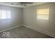 This bedroom is airy and bright with neutral walls, new flooring, and two bright windows at 1306 Woodbine Dr, Anderson, IN 46011