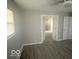 A bedroom with neutral walls and modern flooring at 1306 Woodbine Dr, Anderson, IN 46011