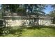 Traditional single-story home with a well-manicured lawn and attached one-car garage at 1306 Woodbine Dr, Anderson, IN 46011