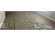 New vinyl flooring in the living room at 1306 Woodbine Dr, Anderson, IN 46011