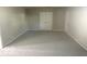 Living room with neutral paint and carpet throughout at 1306 Woodbine Dr, Anderson, IN 46011