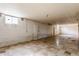 An empty unfinished basement with light tile flooring and painted walls at 1310 S Catherwood Ave, Indianapolis, IN 46203
