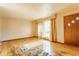 Bright and airy living room featuring hardwood floors and a large window, offering ample natural light at 1310 S Catherwood Ave, Indianapolis, IN 46203