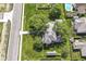 Aerial view of a home with mature trees, a large yard, a detached garage, and a well-maintained landscape at 1325 Fordice Rd, Lebanon, IN 46052