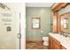Bathroom features a glass shower stall, wood-look flooring, and light green wall paint at 1325 Fordice Rd, Lebanon, IN 46052