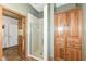 Bathroom with a walk-in shower and built-in wood storage at 1325 Fordice Rd, Lebanon, IN 46052