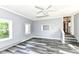 Bedroom features two windows for natural light, grey vinyl flooring and white trim at 1325 Fordice Rd, Lebanon, IN 46052
