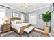 Bright bedroom featuring hardwood floors, neutral colors, and decor creating a relaxing atmosphere at 1325 Fordice Rd, Lebanon, IN 46052