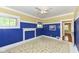 Bedroom features yellow and blue design, white ceiling fan, and natural light at 1325 Fordice Rd, Lebanon, IN 46052