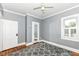 Bedroom with hardwood floors, gray walls, white trim, and an area rug at 1325 Fordice Rd, Lebanon, IN 46052