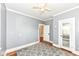 Bedroom with hardwood floors, gray walls, white trim, and an area rug at 1325 Fordice Rd, Lebanon, IN 46052