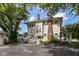 Two-story home features a brick chimney, green front door and ample parking at 1325 Fordice Rd, Lebanon, IN 46052