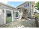 Exterior view of the home featuring a wooden deck, neutral siding, and whimsical artwork at 1325 Fordice Rd, Lebanon, IN 46052