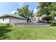 Spacious home with a three-car garage and a large driveway, surrounded by mature trees and a well-maintained lawn at 1325 Fordice Rd, Lebanon, IN 46052
