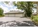 Exterior view of a large garage with multiple bays and a spacious driveway at 1325 Fordice Rd, Lebanon, IN 46052