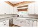 Updated kitchen with white cabinetry, granite countertops, stainless steel appliances and a farmhouse sink at 1325 Fordice Rd, Lebanon, IN 46052