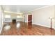 Spacious living room with hardwood floors, fireplace, and staircase access, ideal for Gathering gatherings at 1325 Fordice Rd, Lebanon, IN 46052
