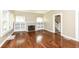 Bright living room featuring hardwood floors, fireplace, and large windows, creating a cozy atmosphere at 1325 Fordice Rd, Lebanon, IN 46052