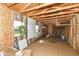Interior of a shed with exposed wooden framing, insulation, and pegboards for organization at 1325 Fordice Rd, Lebanon, IN 46052
