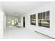 Spacious sunroom featuring white walls, large windows and a ceiling fan for relaxing at 1325 Fordice Rd, Lebanon, IN 46052