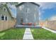 Backyard with a seating area, stepping stone pathway, and privacy fence at 1425 Kennington St, Indianapolis, IN 46225