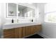 Modern bathroom with double vanity, sleek fixtures, and stylish lighting at 1425 Kennington St, Indianapolis, IN 46225