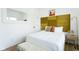 Bright bedroom features a plush bed, eye-catching headboard, and modern decor at 1425 Kennington St, Indianapolis, IN 46225