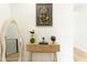 Inviting hallway featuring stylish console table with elegant decor and modern artwork at 1425 Kennington St, Indianapolis, IN 46225