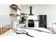 Modern kitchen featuring sleek countertops and floating shelves at 1425 Kennington St, Indianapolis, IN 46225