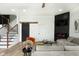 Comfortable living room with fireplace, stairs, and open floor plan at 1425 Kennington St, Indianapolis, IN 46225