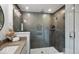 Modern bathroom with glass-enclosed shower, neutral tile, and stylish fixtures at 1452 E Greyhound E Pass, Carmel, IN 46032