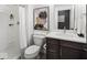 Modern bathroom featuring a shower with white curtain, floating vanity, and stylish decorative art at 1452 E Greyhound E Pass, Carmel, IN 46032