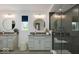 Bright and modern bathroom with double vanities, and glass-enclosed shower at 1452 E Greyhound E Pass, Carmel, IN 46032