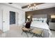 Well-lit bedroom with neutral decor, tray ceilings, beams and modern furnishings at 1452 E Greyhound E Pass, Carmel, IN 46032