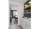 Butler's pantry featuring white cabinets, marble countertops, and a view to the dining room at 1452 E Greyhound E Pass, Carmel, IN 46032